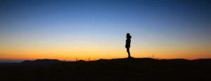 sunset silhoetting a man