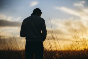 shadow of a man in a field