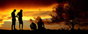 group of people at sunset